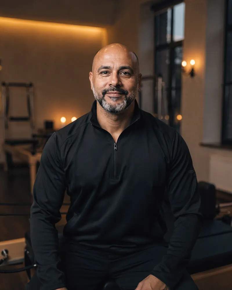 Marcus, a Pilates teacher in his forties, in the studio