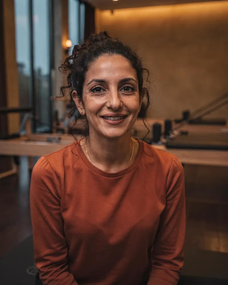 Noor, a Pilates teacher in her forties, in the studio